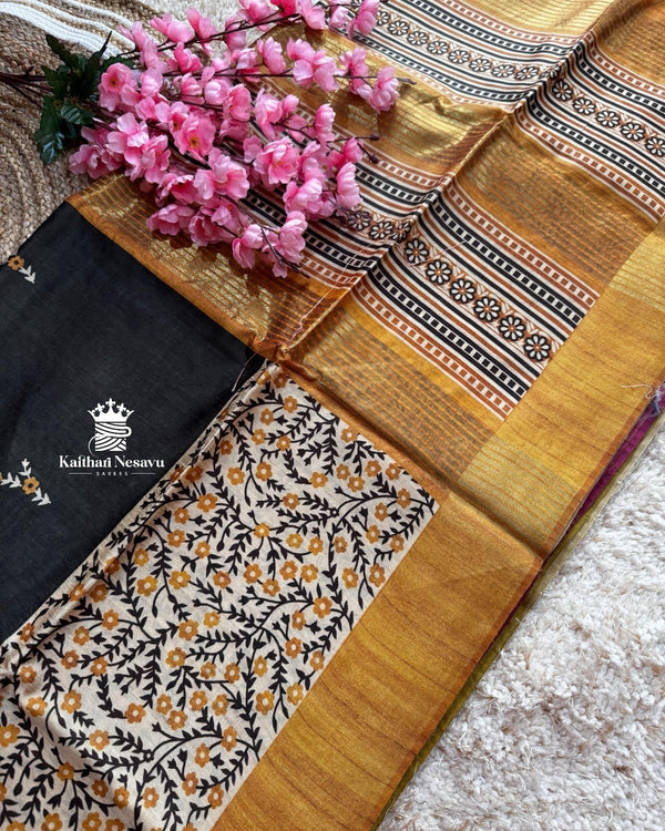 Black with golden border Ghicha Tussar Digital Printed Saree – Graceful Semi-Handloom Weave by Kaithari Nesavu, Ideal for Evening Occasions & Office Wear.