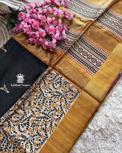 Black with golden border Ghicha Tussar Digital Printed Saree – Graceful Semi-Handloom Weave by Kaithari Nesavu, Ideal for Evening Occasions & Office Wear.