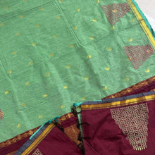 Pista green handloom saree with gold motifs and maroon zari pallu, traditional design