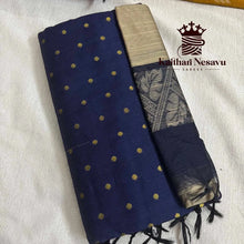 Navy blue handloom saree with gold polka dots and beige zari border on white fabric