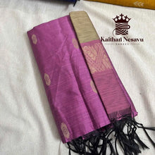 Purple handloom silk saree with golden border and zari motifs, displayed folded on fabric