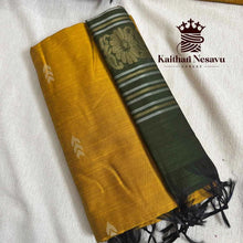 Handloom cotton saree in mustard yellow with green pallu featuring floral and striped designs