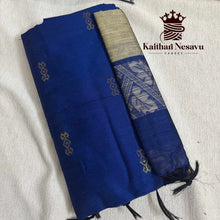Blue handloom silk saree with gold zari border and traditional motifs on light fabric background