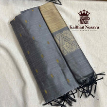 Handloom cotton saree in grey with gold pallu and small motifs, traditional Indian design