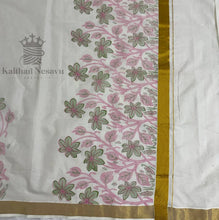 Kerala saree pallu with pink and green floral pattern and gold border on white cotton fabric