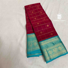 Maroon pure handloom silk saree with Sky Blue contrast border