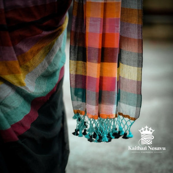 Colorful striped saree with tassels on a neutral background
