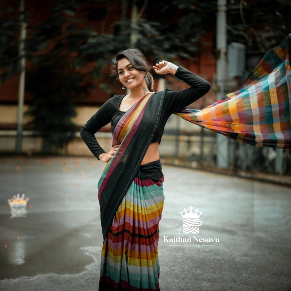 Woman in a colorful saree with a blurred background