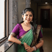 Sundari: A Classic Beauty in Gold Zari Cotton Saree piistagreen body and purple border
