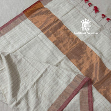 Festive Onam linen saree in white checks with copper border and red pallu