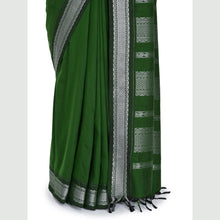 Close-up of silver zari Kolam border on Green cotton saree