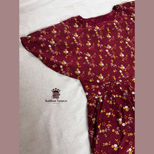 Closeup of maroon rayon cape maternity dress showcasing soft rayon fabric – Vineshu