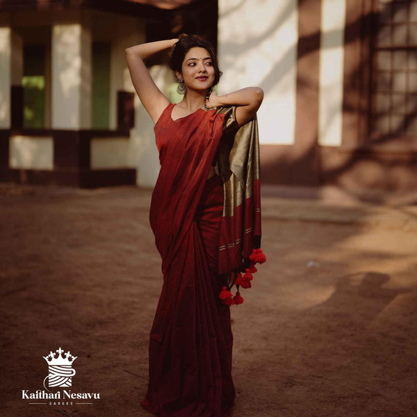 Mookuthi Amman inspired gicha silk saree in maroon by Kaithari Nesavu – rich festive drape for temple wear styling.