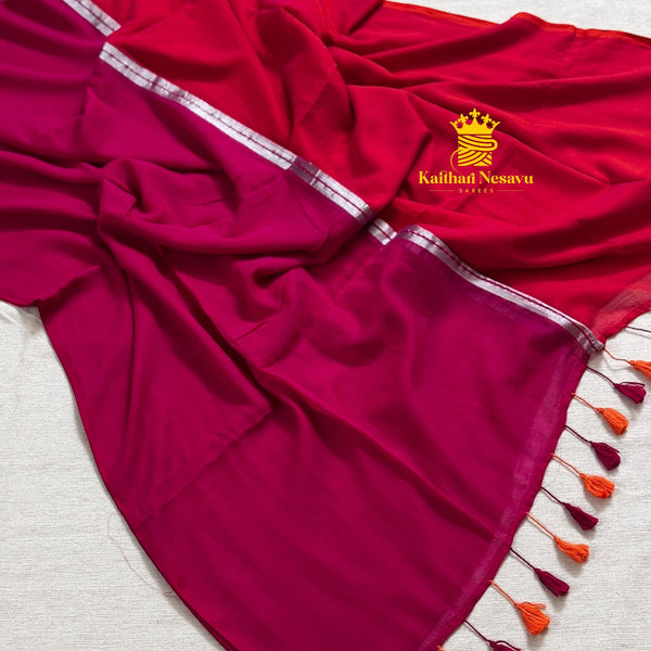 Dark pink and orange mul cotton saree with silver stripes in the middle and tassel finish
