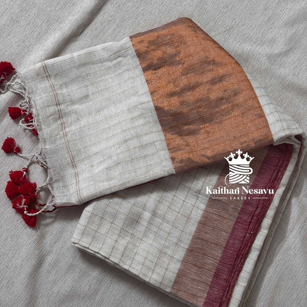 Onam special white checked linen saree with copper zari border and festive design