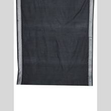 Black fabric with a subtle pattern on a light gray background
