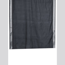 Dark gray fabric with a subtle pattern on a light gray background