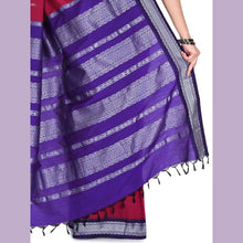 Purple and gray striped fabric with a person holding it against a light purple background