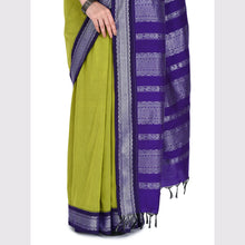 Green saree with a purple border on a white background