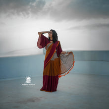 Woman in a traditional saree standing against a plain background with 'Kaithari Nesava' branding.