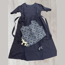 Close-up of dark blue maternity cotton dress with feeding zip detail.