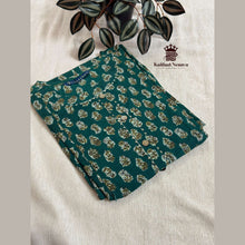 Close-up of Teal Green maternity dress with invisible feeding zip and rope